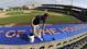 Geo Rodriguez paints the top of a dugout at Osceola County Stadium, the Houston Astros' facility.