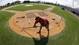 Grounds crew member Michael Schnee works around home plate at Space Coast Stadium, the Washington Nationals home in Viera, Fla.
