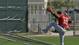 Red Sox shortstop Jose Iglesias loses the ball as he crashes into a screen in Fort Myers, Fla.