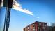 A meteorite left a smoke trail over an apartment building.