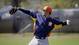 Houston Astros first baseman Carlos Pena throws at a workout.