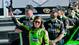 Danica Patrick waves to her fans after making NASCAR history by becoming the first woman to win a Sprint Cup pole. Patrick qualified first for the 2013 Daytona 500 on Feb. 17.