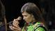 Danica Patrick applies makeup before a television interview during NASCAR media day at Daytona International Speedway on Feb. 14, 2013.