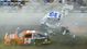 NASCAR Nationwide Series driver Kyle Larson (32) goes up into the fence after being involved in a crash on the final lap during the DRIVE4COPD 300 at Daytona International Speedway.
