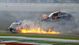 The car of NASCAR Nationwide Series driver Kyle Larson (32) catches fire after a crash during the DRIVE4COPD 300 at Daytona International Speedway.