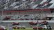 A general view as fans watch track workers repair the catch fence after a crash on the final lap of the DRIVE4COPD 300 at Daytona International Speedway.