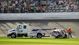 The car of NASCAR Nationwide Series driver Kyle Larson (32) is towed off the track after a crash during the DRIVE4COPD 300 at Daytona International Speedway.