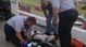 Emergency responders attend to an injured fan in the stands after a crash on the final lap of the DRIVE4COPD 300 at Daytona International Speedway.