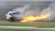 The car of NASCAR Nationwide Series driver Kyle Larson catches fire after a crash during the DRIVE4COPD 300 at Daytona International Speedway.