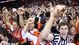 Virginia Cavaliers fans celebrate on the court after the Cavaliers' game against the Duke Blue Devils at John Paul Jones Arena.