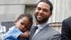 Nets point guard Deron Williams holds son D.J. during a July 2012 news conference in Brooklyn.