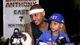 Knicks forward Carmelo Anthony fields questions during 2013 All-Star weekend with son Kiyan on his lap.