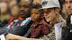 Chris Paul II watches his father, Clippers guard Chris Paul, play while sitting with pop star Justin Bieber.