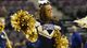 An Akron Zips cheerleader cheers team on in the second half against the Virginia Commonwealth Rams.