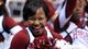 A Harvard Crimson cheerleader smiles during the second half of the game against the New Mexico Lobos.