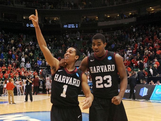 West Regional (Salt Lake City): Harvard guard Siyani Chambers celebrates the school's first NCAA tournament win after the 14th-seeded Crimson defeated No. 3 seed New Mexico.
