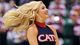 A Arizona Wildcats cheerleader performs in the first half of the game against the Harvard Crimson during the third round at EnergySolutions Arena.