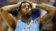 North Carolina guard P.J. Hairston walks to the bench after losing to Kansas 70-58.