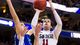 San Diego State Aztecs guard James Rahon (11) shoots under pressure from Florida Gulf Coast Eagles guard Brett Comer (0) during the second half against San Diego State.
