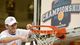 Florida Gulf Coast Eagles guard Brett Comer (0) cuts the net following their 88-75 victory over the Mercer Bears in the championship game of the Atlantic Sun tournament at Hawkins Arena.