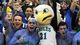 From left, Kristian Avellanet, Nick Schilson, Florida Gulf Coast University mascot Azul, Nick Mucerino and Dario Nachef celebrate the Eagles' trip to the Sweet 16 during a pep rally at Alico Arena in Fort Myers, Fla.