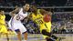 Michigan Wolverines guard Tim Hardaway Jr. (10) drives to the basket past Kansas Jayhawks guard Travis Releford (24) in the first half during the semifinals of the South Regional of the NCAA tournament at Cowboys Stadium.