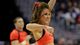 A Syracuse cheerleader performs during the Elite Eight matchup with Marquette at the Verizon Center in Washington.