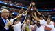 Syracuse players hold up the East Regional trophy after defeating Marquette 55-39 at the Verizon Center in Washington.
