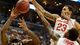 Ohio State's Deshaun Thomas (1) and center Amir Williams (23) defend against Wichita State's Carl Hall in the first half of the West Regional final at the Staples Center in Los Angeles.