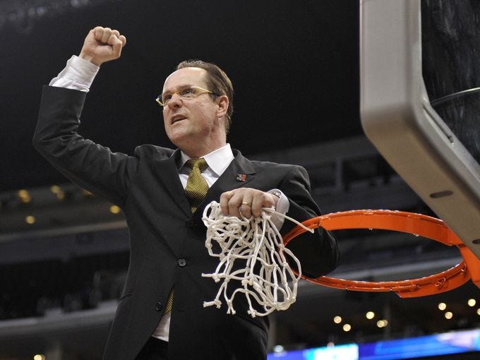 Wichita State head coach Gregg Marshall celebrates cutting down the net after beating Ohio State 70-66 in the West Regional final to advance to the Final Four.