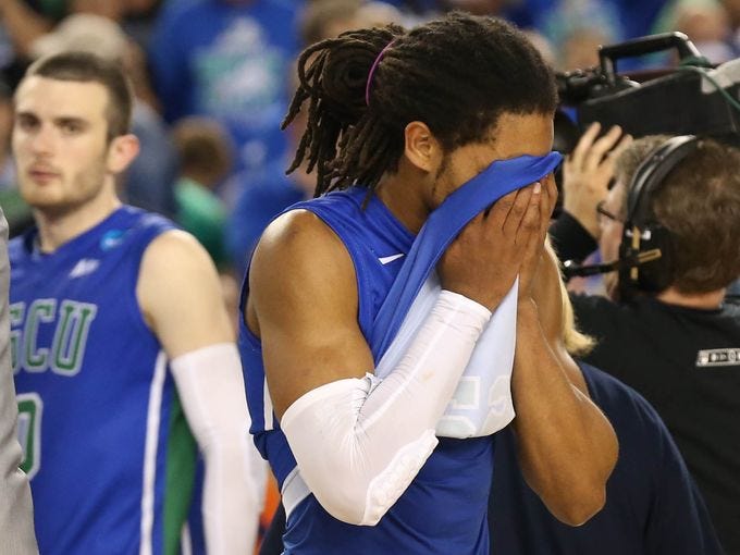 Florida Gulf Coast Eagles guard Sherwood Brown reacts after losing to the Florida Gators 62-50 in the semifinals of the South regional at Cowboys Stadium.