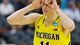 Michigan's Nik Stauskas reacts after making a three-point shot during the first half of a regional final game against Florida in the NCAA college basketball tournament.