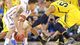 Michigan Wolverines forward Jordan Morgan (52) tries to tip the ball loose from Florida Gators guard Scottie Wilbekin (5) during the second half of the South regional final game in the 2013 NCAA Tournament at Cowboys Stadium.