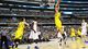 Mitch McGary (4) of the Michigan Wolverines dunks against the Florida Gators in the first half during the South Regional Round Final of the 2013 NCAA tournament at Dallas Cowboys Stadium in Arlington, Texas.