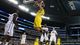 Mitch McGary (4) of the Michigan Wolverines dunks over the Florida Gators in the first half during the South regional final of the 2013 NCAA Men's tournament at Dallas Cowboys Stadium in Arlington, Texas.