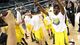 Michigan Wolverines guard Corey Person (32) celebrates as his team defeats the Florida Gators 79-59 to advance to the Final Four during the South regional final of the 2013 NCAA Tournament at Cowboys Stadium.