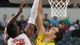Michigan Wolverines forward Mitch McGary (4) blocks the shot of Florida Gators forward Will Yeguete (15) in the first half during the South regional final of the 2013 NCAA Tournament at Cowboys Stadium.