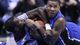 Louisville Cardinals center Gorgui Dieng wrestles for a loose ball on the floor with Duke Blue Devils guard Rasheed Sulaimon in the second half during the finals of the Midwest regional at Lucas Oil Stadium.