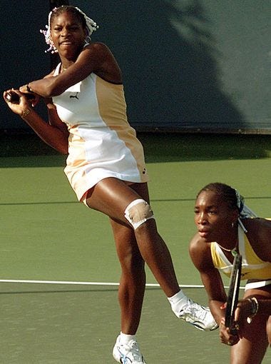 Serena and Venus Williams playing in the 1999 Evert Cup