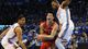Game 1 in Oklahoma City: Thunder 120, Rockets 91 - Rockets guard Jeremy Lin drives through Thunder defenders Thabo Sefolosha and Kevin Durant.