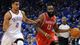 Game 1 in Oklahoma City: Thunder 120, Rockets 91 - Rockets guard James Harden drives against Thunder guard Thabo Sefolosha.