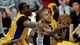 Game 3 in Los Angeles: Spurs 120, Lakers 89 - Spurs guard Tony Parker slips past Lakers center Dwight Howard for a layup.