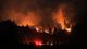A wildfire burns through a forest at the Yellow Jacket Ranch east of Highway 128 near the Napa and Sonoma County line.