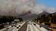 Smoke from a wildfire billows over U.S. 101 on May 2 near Thousand Oaks, Calif.