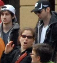 Dzhokhar Tsarnaev, in white hat, and brother Tamerlan, in black hat, are seen in this image taken 10-20 minutes before the Boston Marathon bombings.