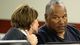 O.J. Simpson speaks with his attorney, Patricia Palm, during a hearing in Clark County District Court in Las Vegas. Simpson is seeking a new trial for his 2008 conviction for armed robbery and kidnapping, claiming he had bad legal representation.