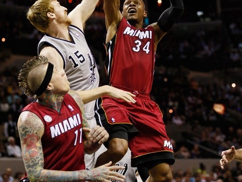 Heat guard Ray Allen shoots over Spurs forward Matt Bonner during a March 31 meeting.