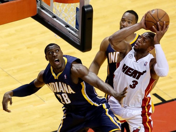 Game 5 in Miami: Heat 90, Pacers 79 - Indiana Pacers shooting guard Lance Stephenson (1) drives against Miami Heat power forward Chris Andersen (11) and center Chris Bosh (1).