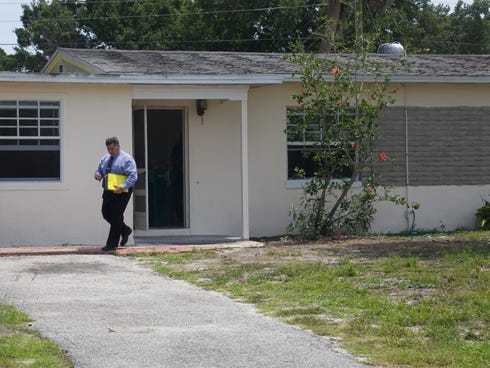 Sheriff's deputies serve a search warrant at a house on Patrick Circle in Melbourne, where police believe Francis Riccio killed his mother, then dismembered and dumped the body.