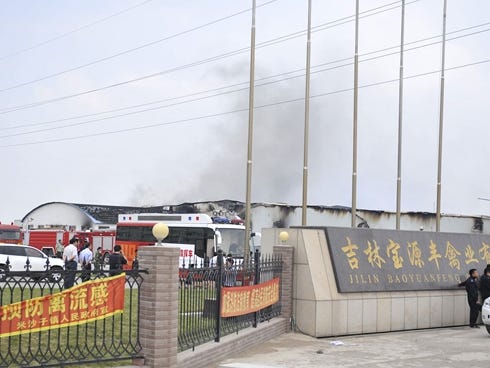 Smoke rises from a poultry farm at the Jilin Baoyuanfeng Poultry Company in Mishazi township of Dehui City, northeast China.
